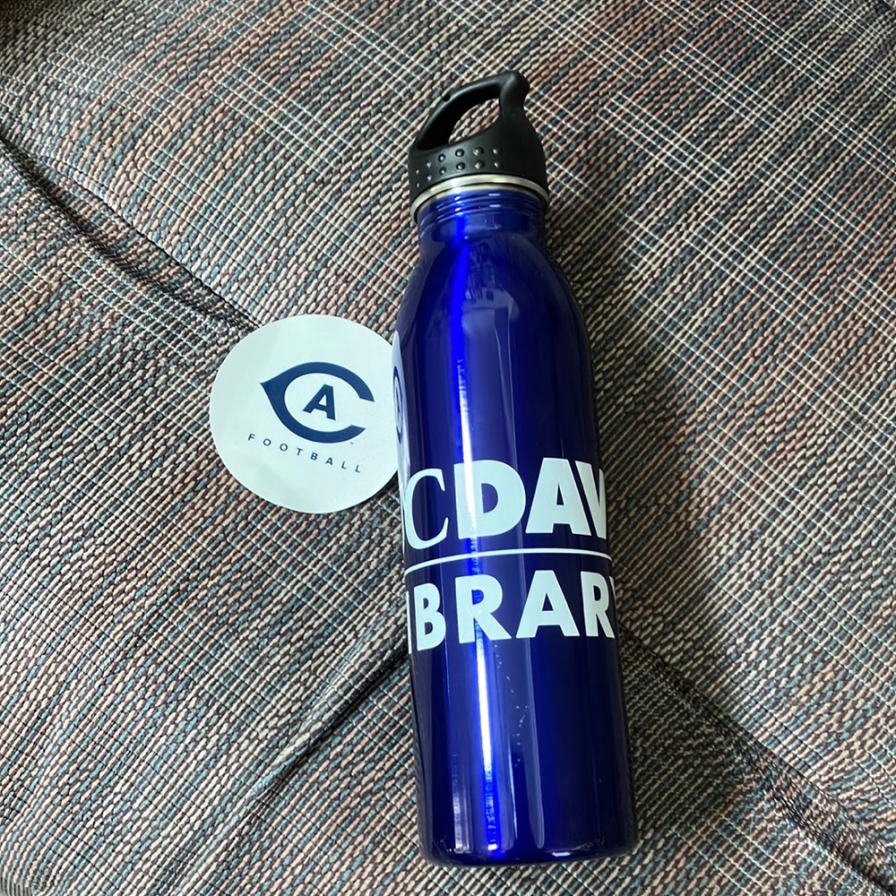 U C Davis swag stainless steel water bottle and sticker